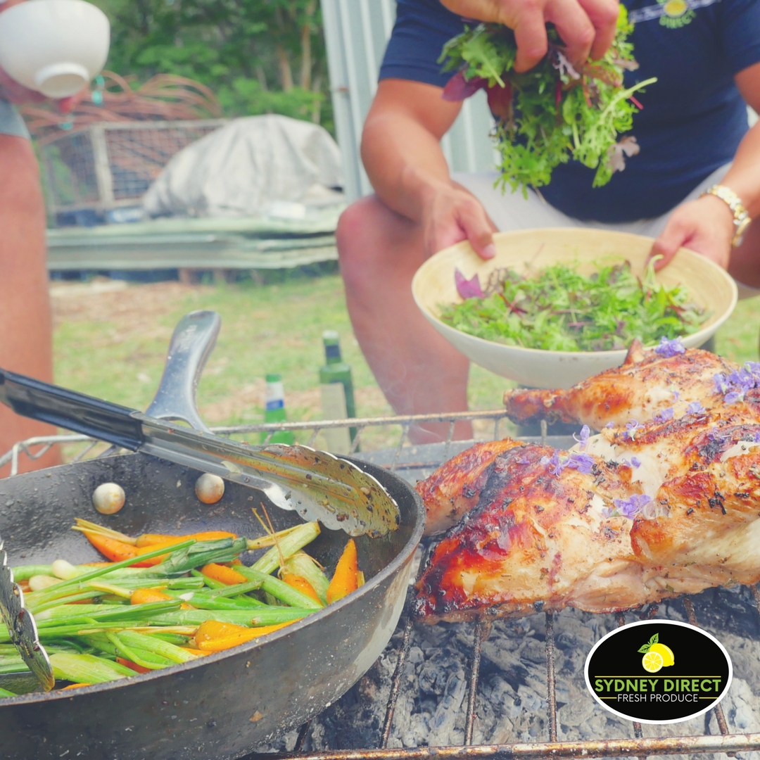 Tony Mann shows us he still has his skills in the kitchen. Petite Bouche produce with his signature fire cooked chicken.
