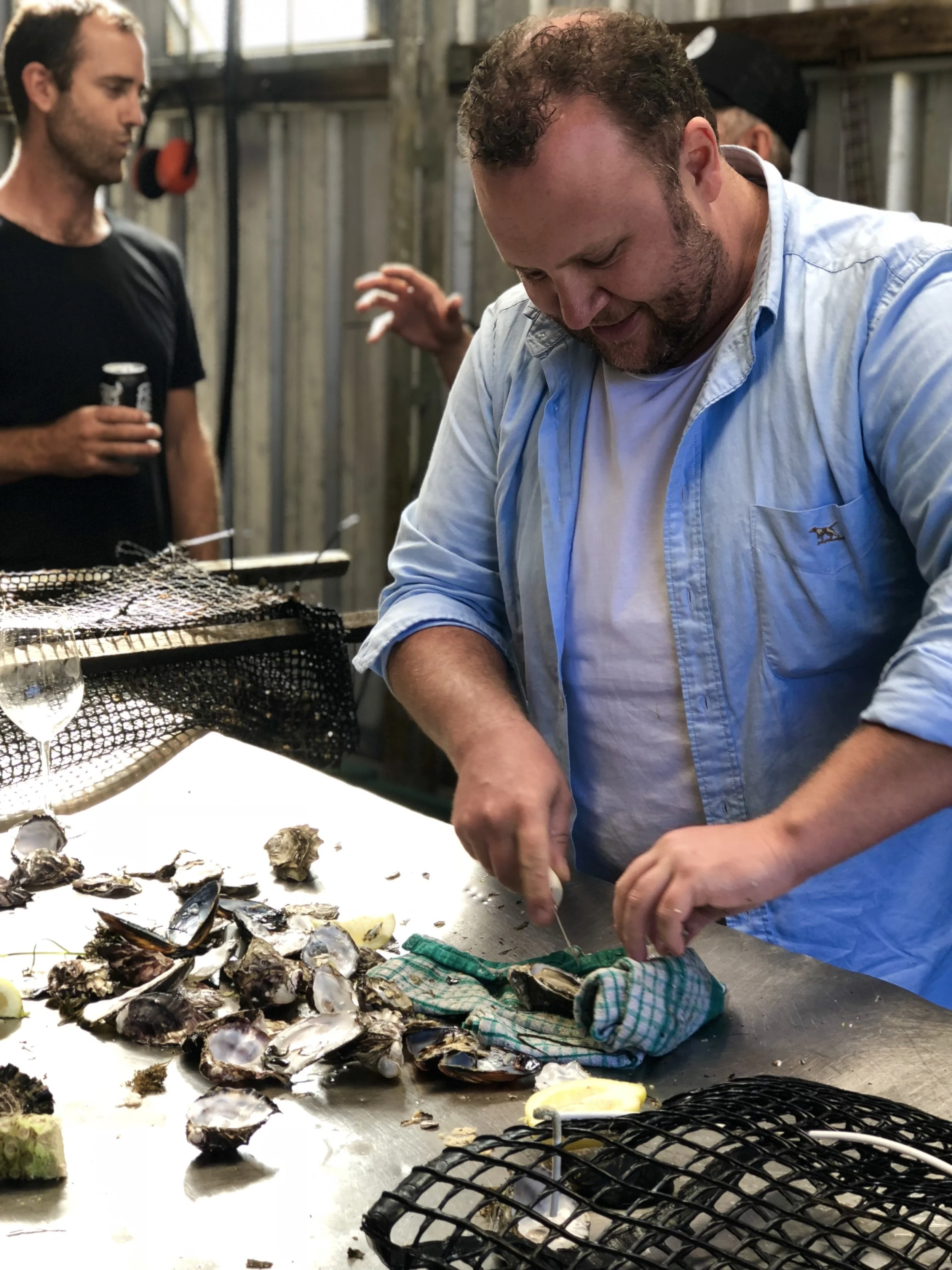 CHEF BEN TURNER SHUCKING FRESH TASSIE OYSTERS TO KICK OFF THE TOUR.