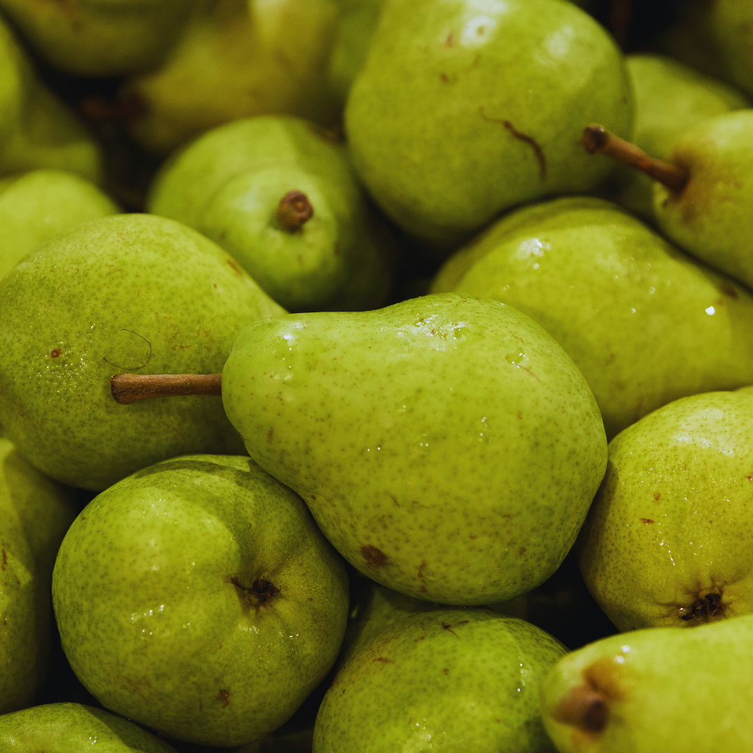 Green pears piled together