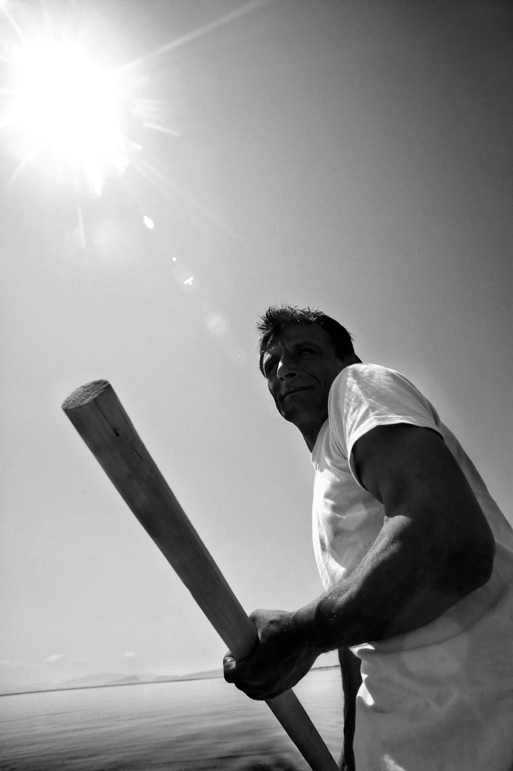 Traditional fisherman at Etoliko lagoon, Greece. Black and white documentary photography by Stavros Kostakis, visual strategist.