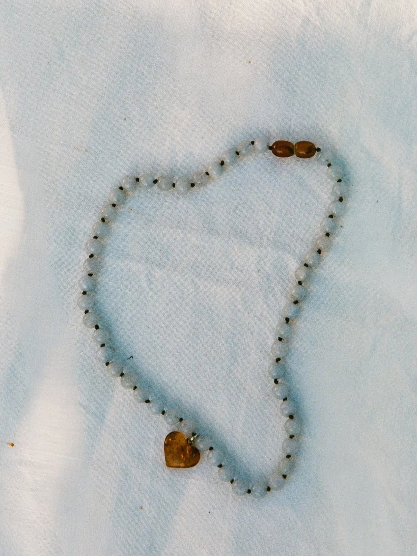 &hellip;necklace with amber heart pendant 🤎 online in blue &amp; pink #boefshopcopenhagen #ambernecklace