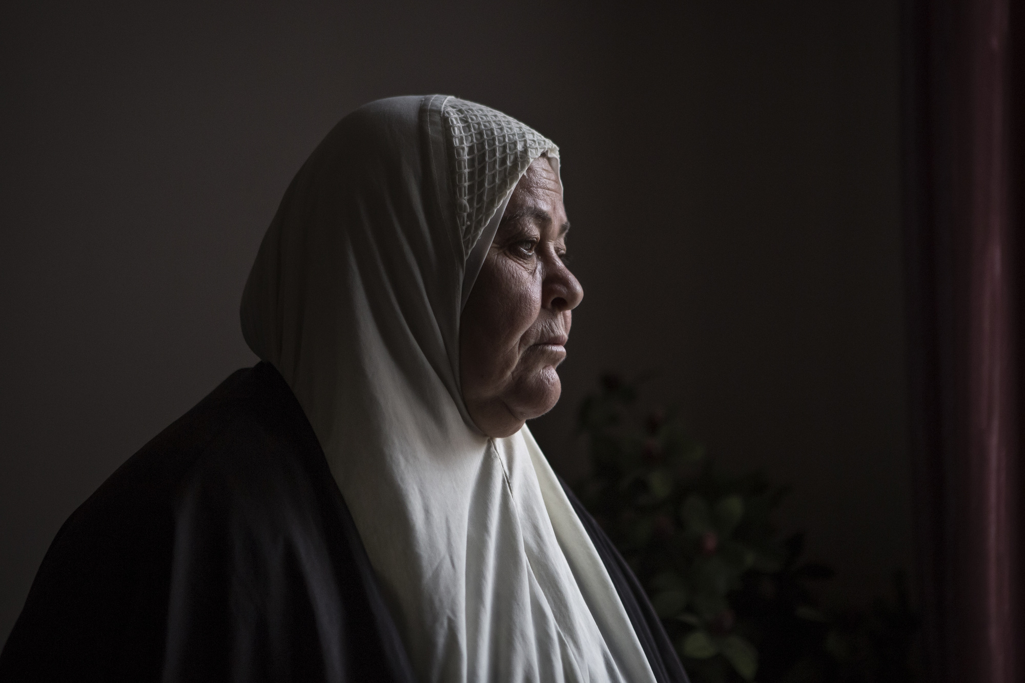  Umm Riyad lost her son when a mortar shell struck the roof of their house in east Mosul. 