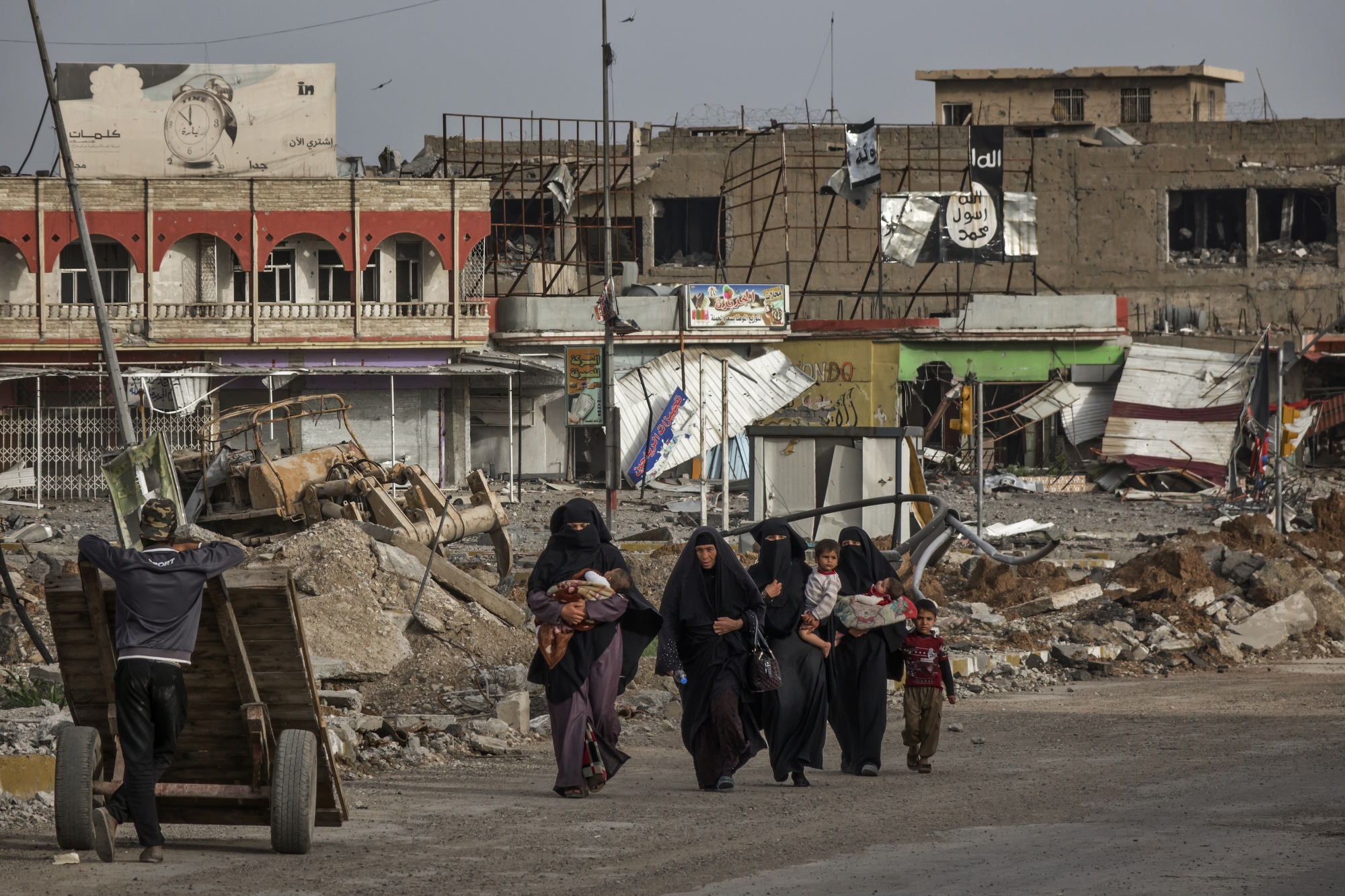  Civilians flee Mosul during the later stages of the battle. 