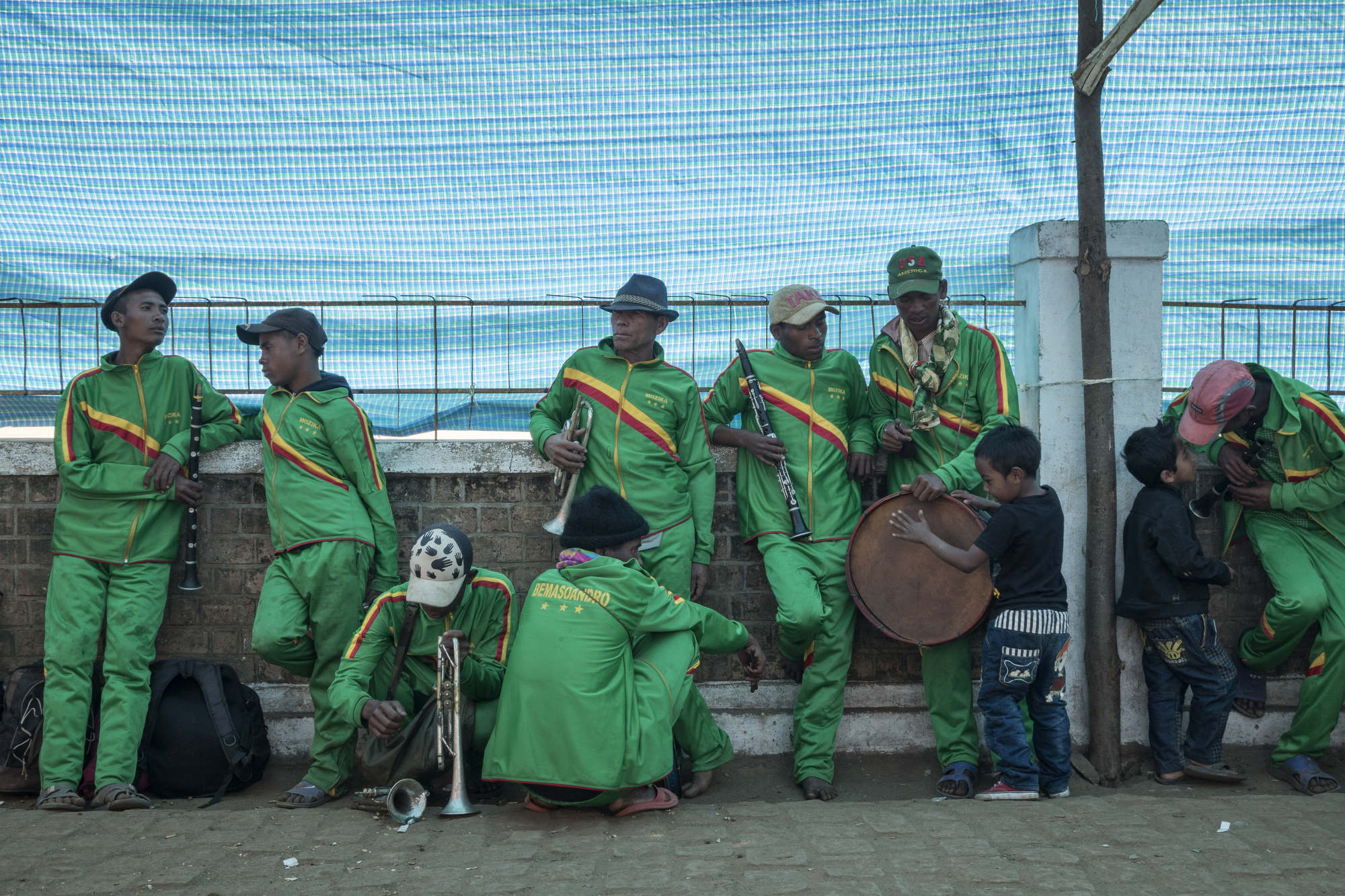  The band waits to play the procession to the cemetery on the morning of the Famadihana. 