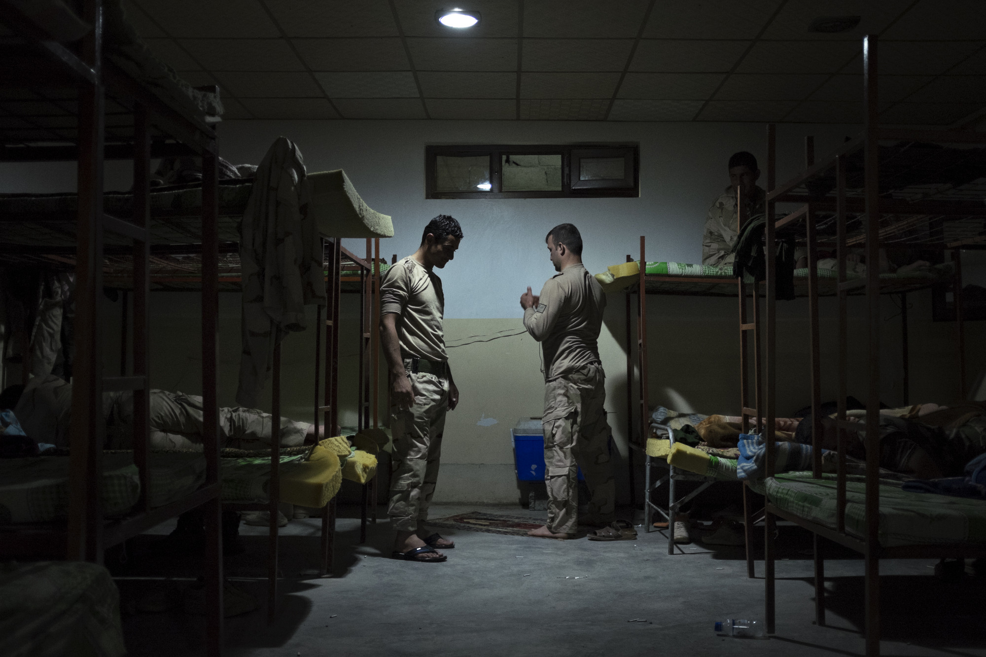  Peshmerga pray before going to sleep. 