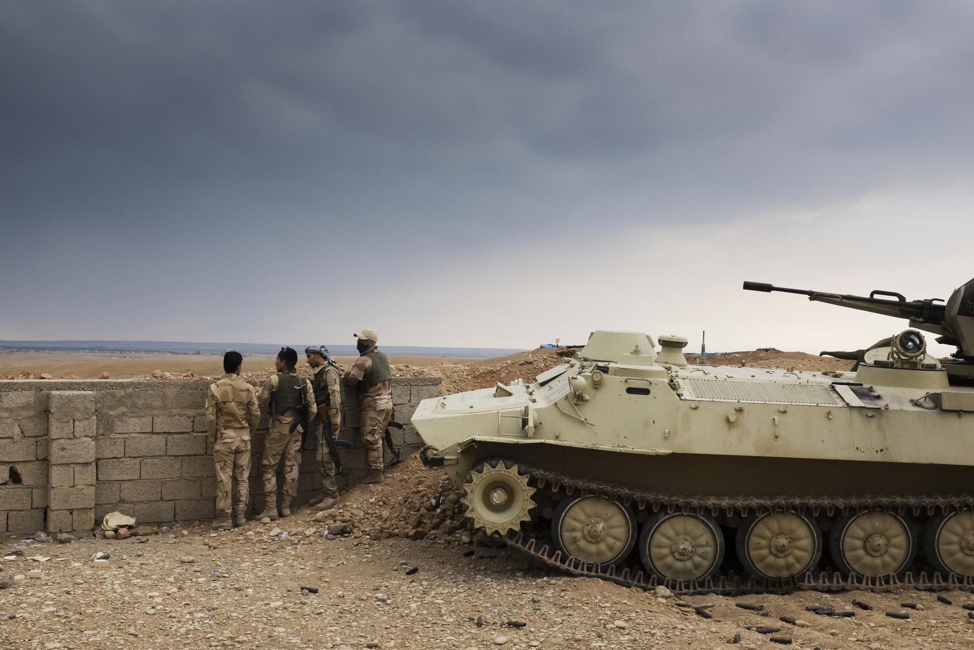  Peshmerga observe Islamic State territory from a front line position. 