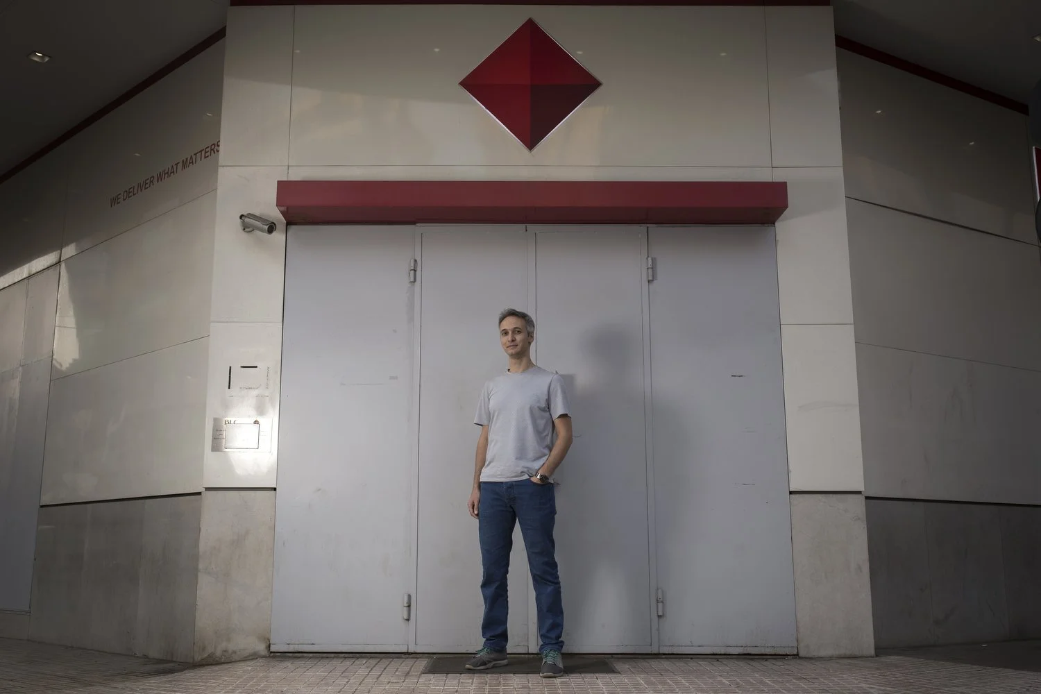  Cryptocurrency broker Nader Dirany pictured in front of the shuttered bank opposite his office. 