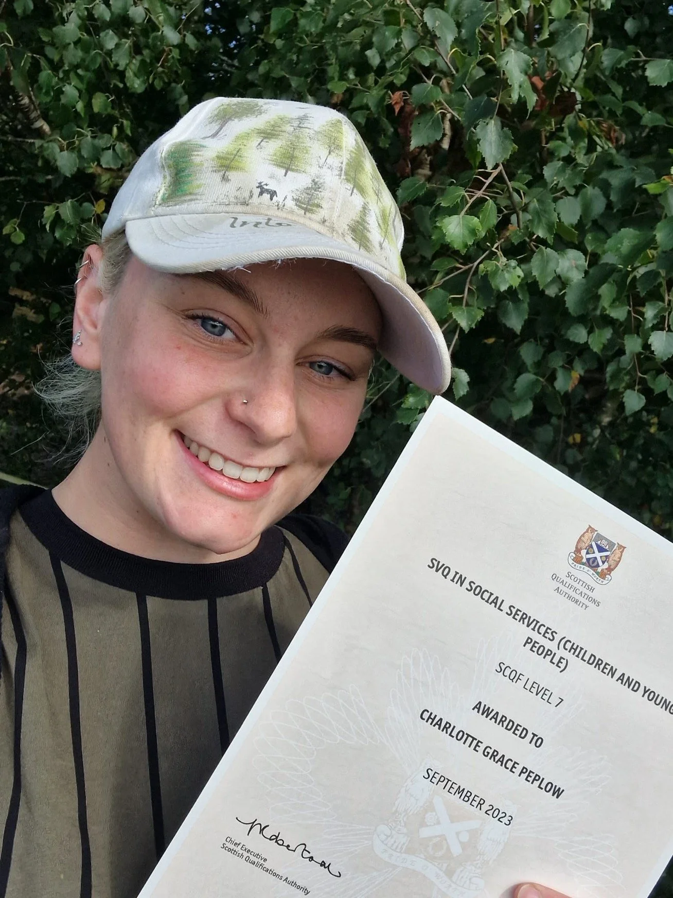 Charlotte Peplow proudly shows her SVQ certificate for completing the Modern Apprenticeship