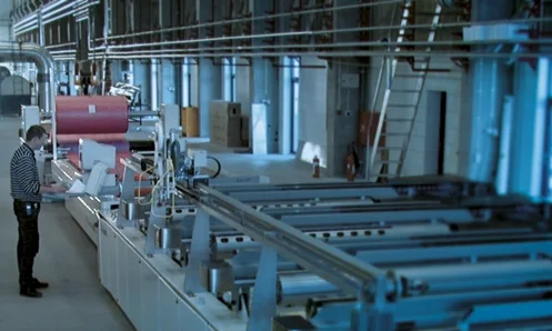 ROLL UP SYSTEM Machine developed to cut prepreg composites for Wind turbine Blade production.