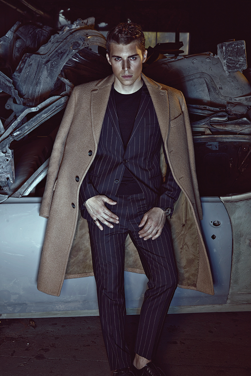 Coat SALVATORE FERRAGAMO $4,810. Suit HUGO by HUGO BOSS $1,195. Ring STEELX $50. Watch VERSACE $2,520.