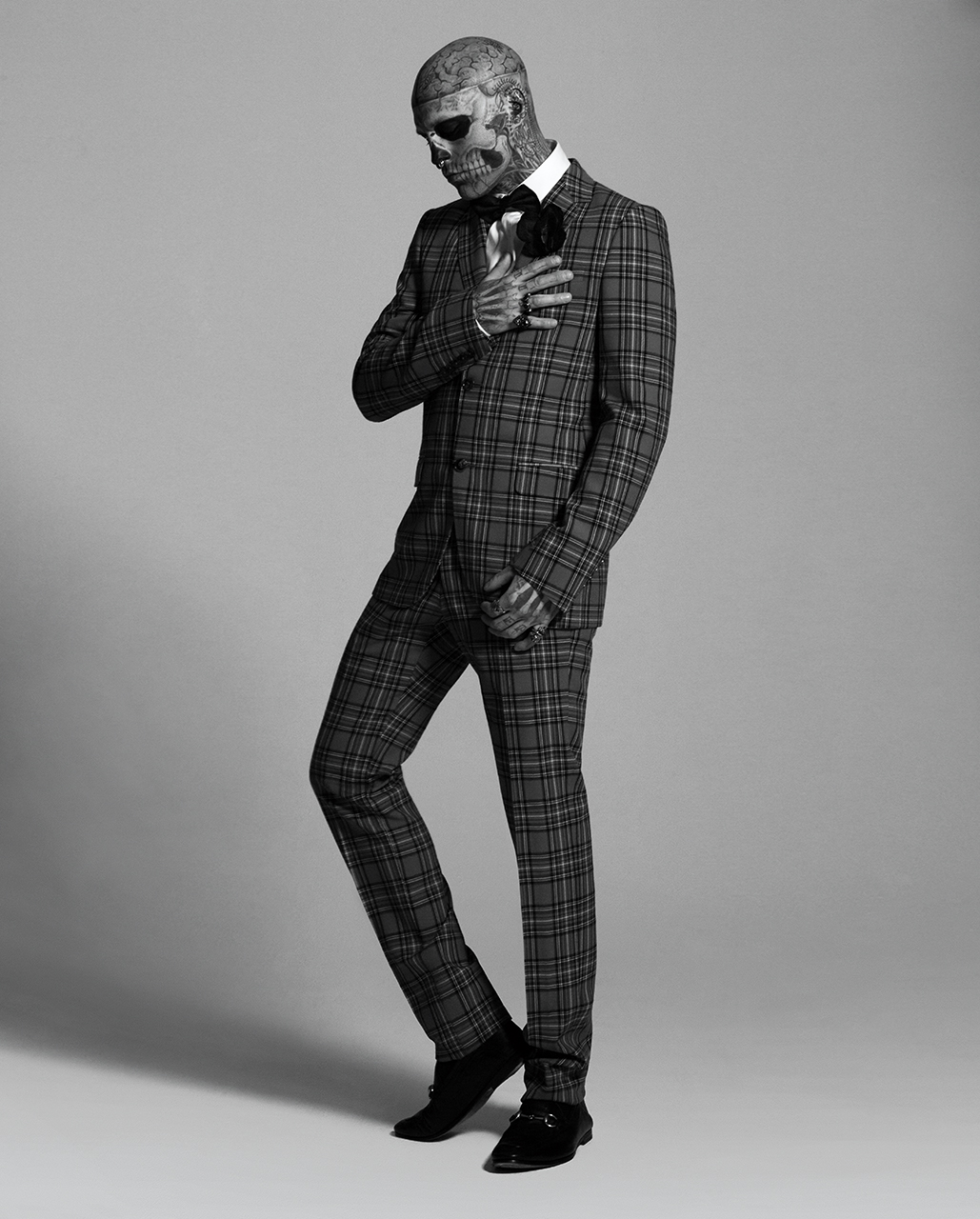 Suit GUCCI $2,980. Shirt GUCCI . Brooch GUCCI . Rings GUCCI $250-$365. Loafers GUCCI . Bow tie MAISON F at MICHEL BRISSON $155.