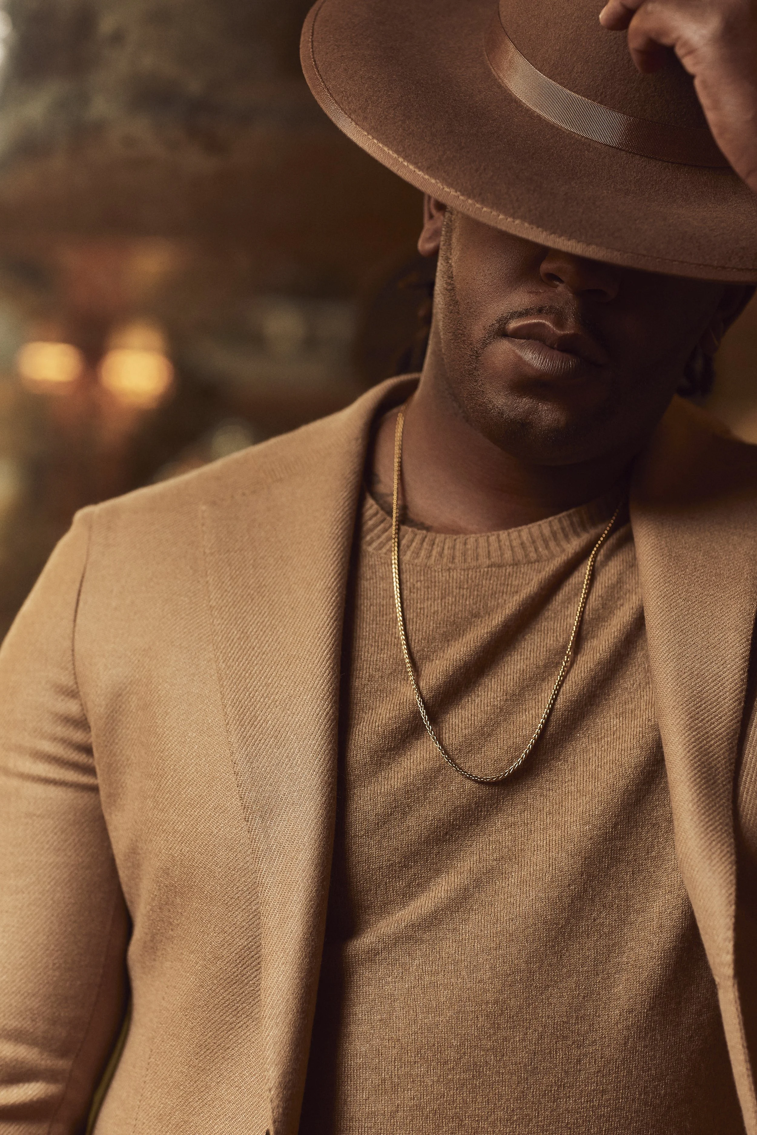Blazer MUNRO at HARRY ROSEN. Sweater BERLUTI at HOLT RENFREW. Hat BRIMZ.