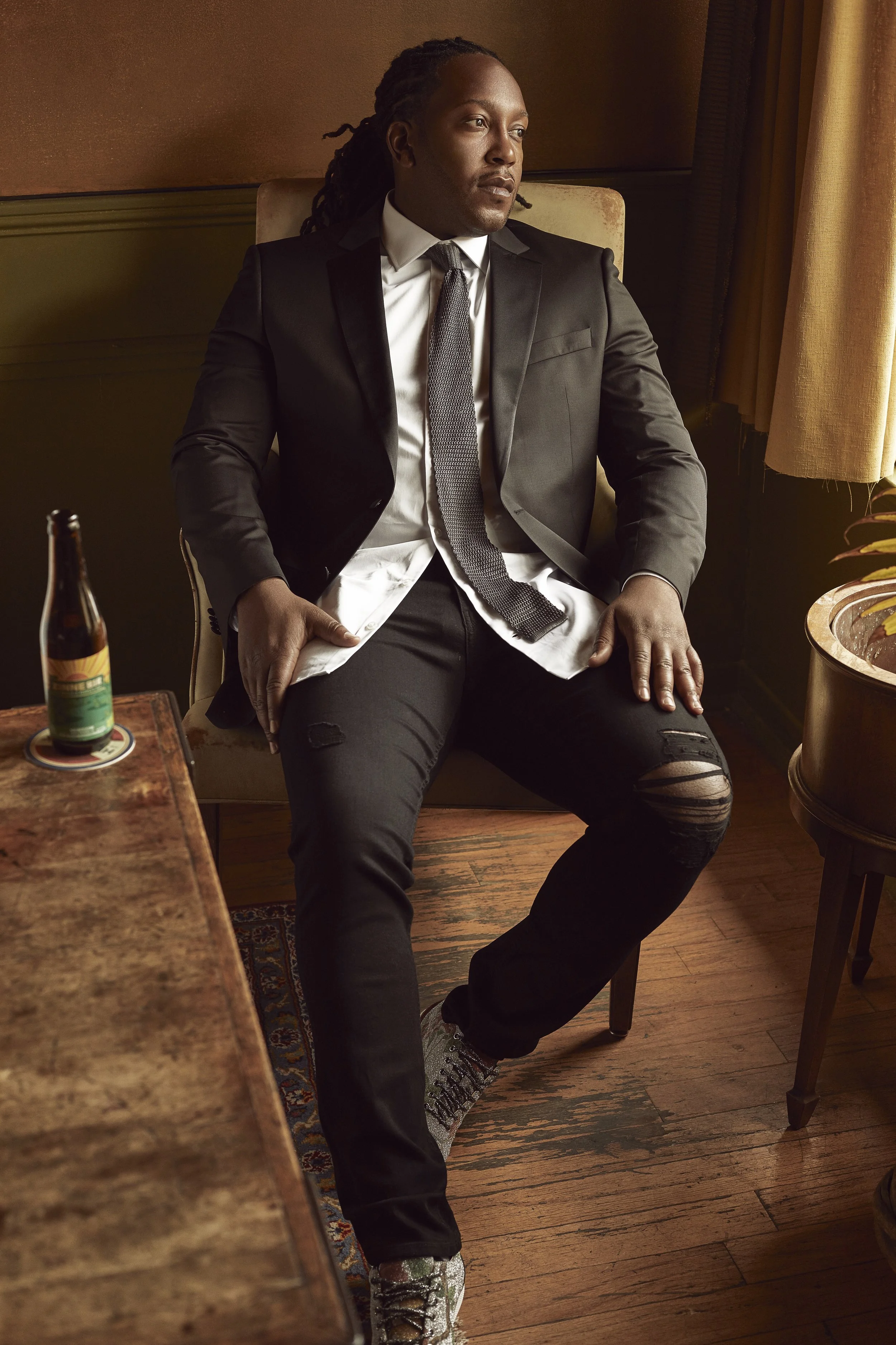 Jacket HUGO BOSS. Shirt GOTSTYLE LAUNCH. Jeans PAIGE at HARRY ROSEN. Tie MAURIZIO BALDASSARI at HARRY ROSEN. Shoes GUCCI.
