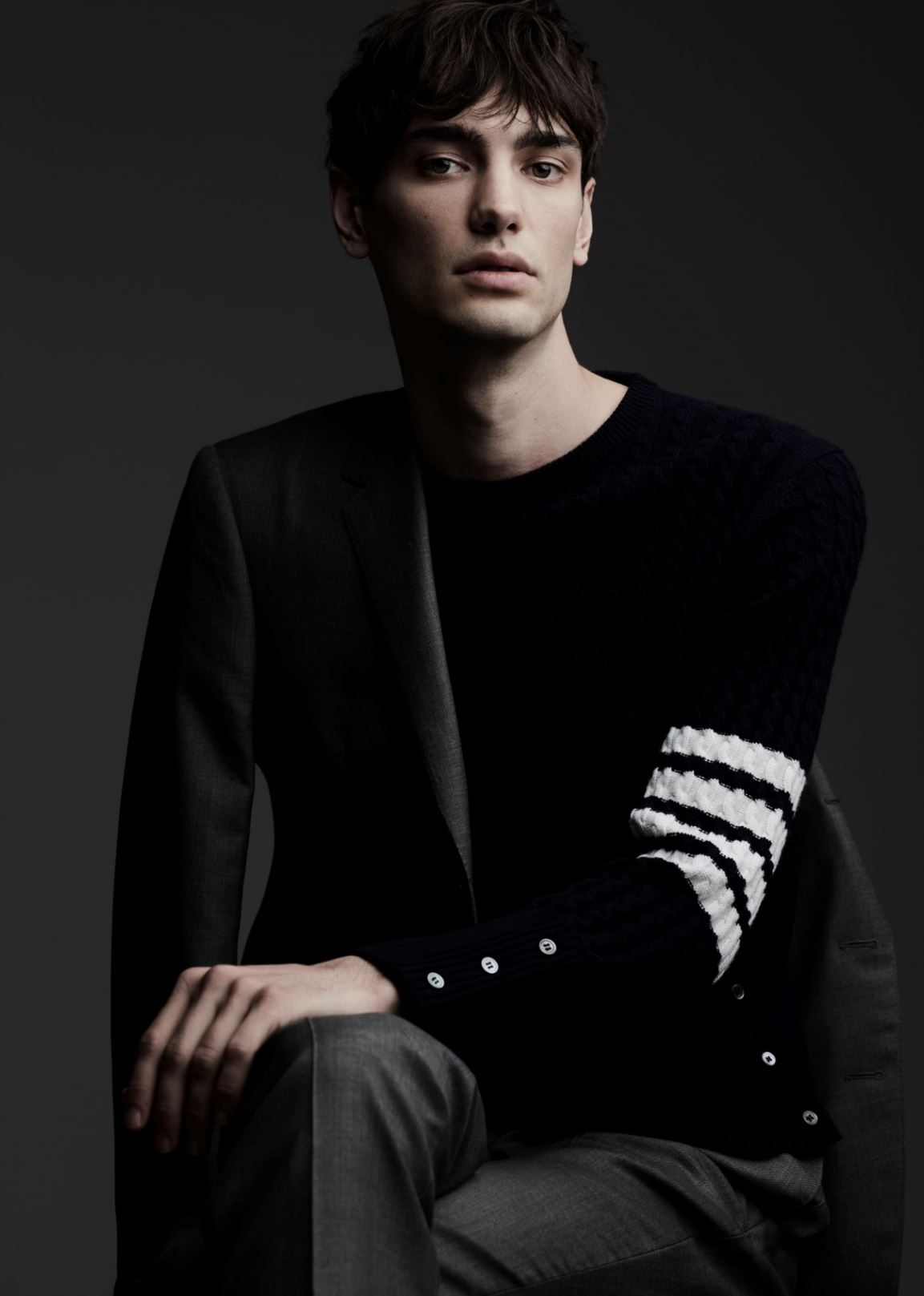 Sweater ($1,500), suit blazer ($3,150), and pants ($1,280) THOM BROWNE at HOLT RENFREW.