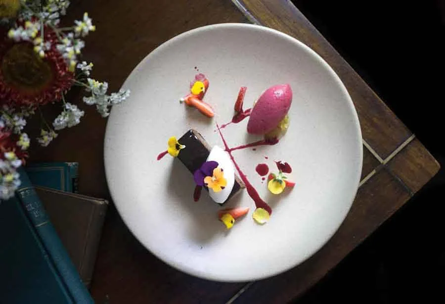 Chocolate mousse, jamaica sorbet, at crema at Maximo Bistrot Local