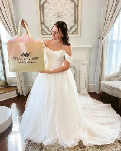 Bride holding a fun swag bag.jpg