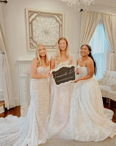 Brides holding a say yes sign at atlanta street bridal.jpg