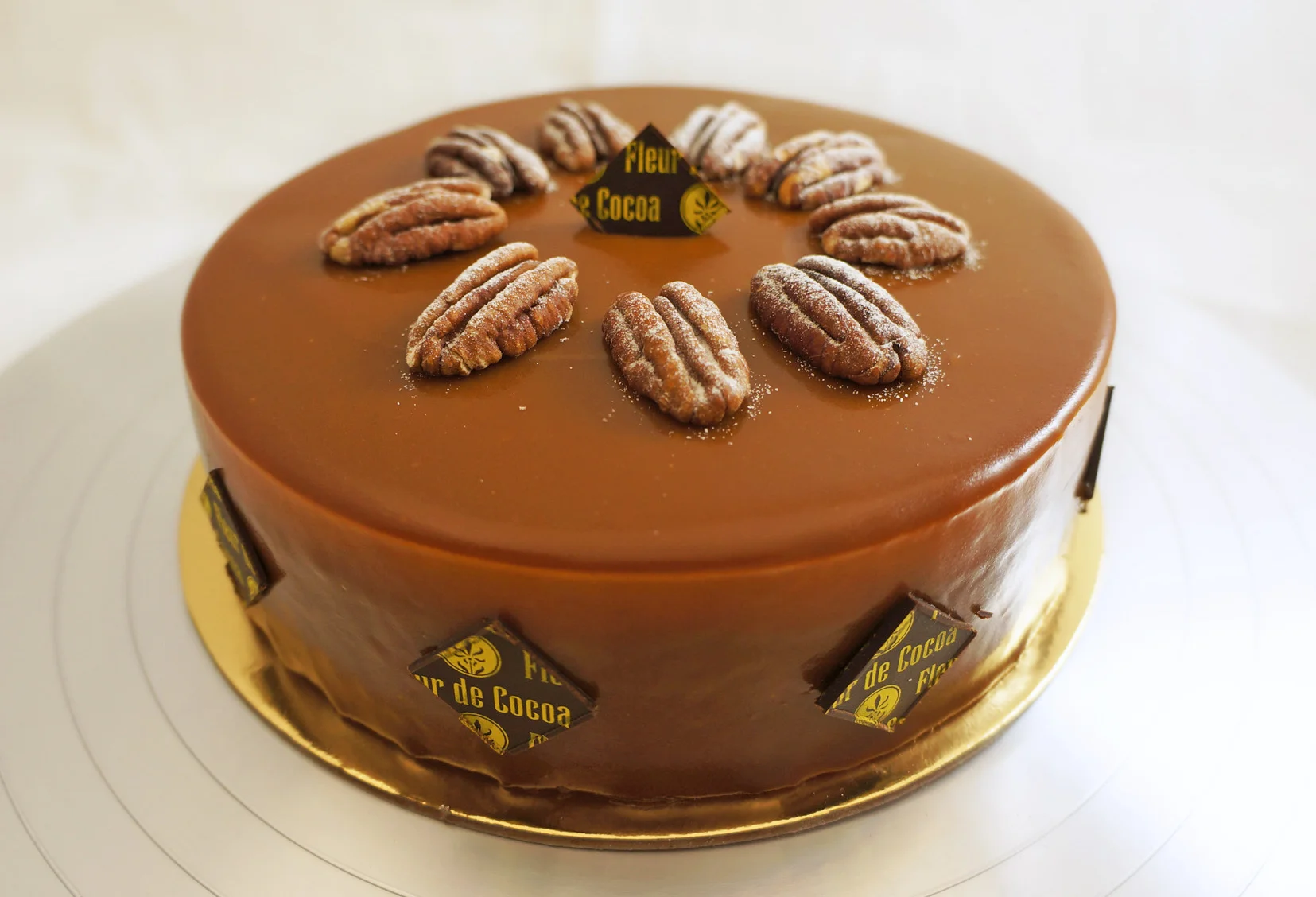 Douceur Layers of creamy caramel mousse, dark chocolate mousse, almond sponge cake with pecan pieces, and chocolate sponge cake (special order). Gluten-free.
