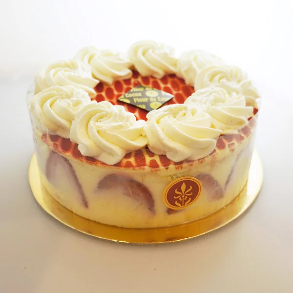 Fraisier Ladyfinger sponge cake soaked with strawberry syrup, layered with vanilla Crème Madame and fresh strawberries (seasonal, special order). Gluten-free.