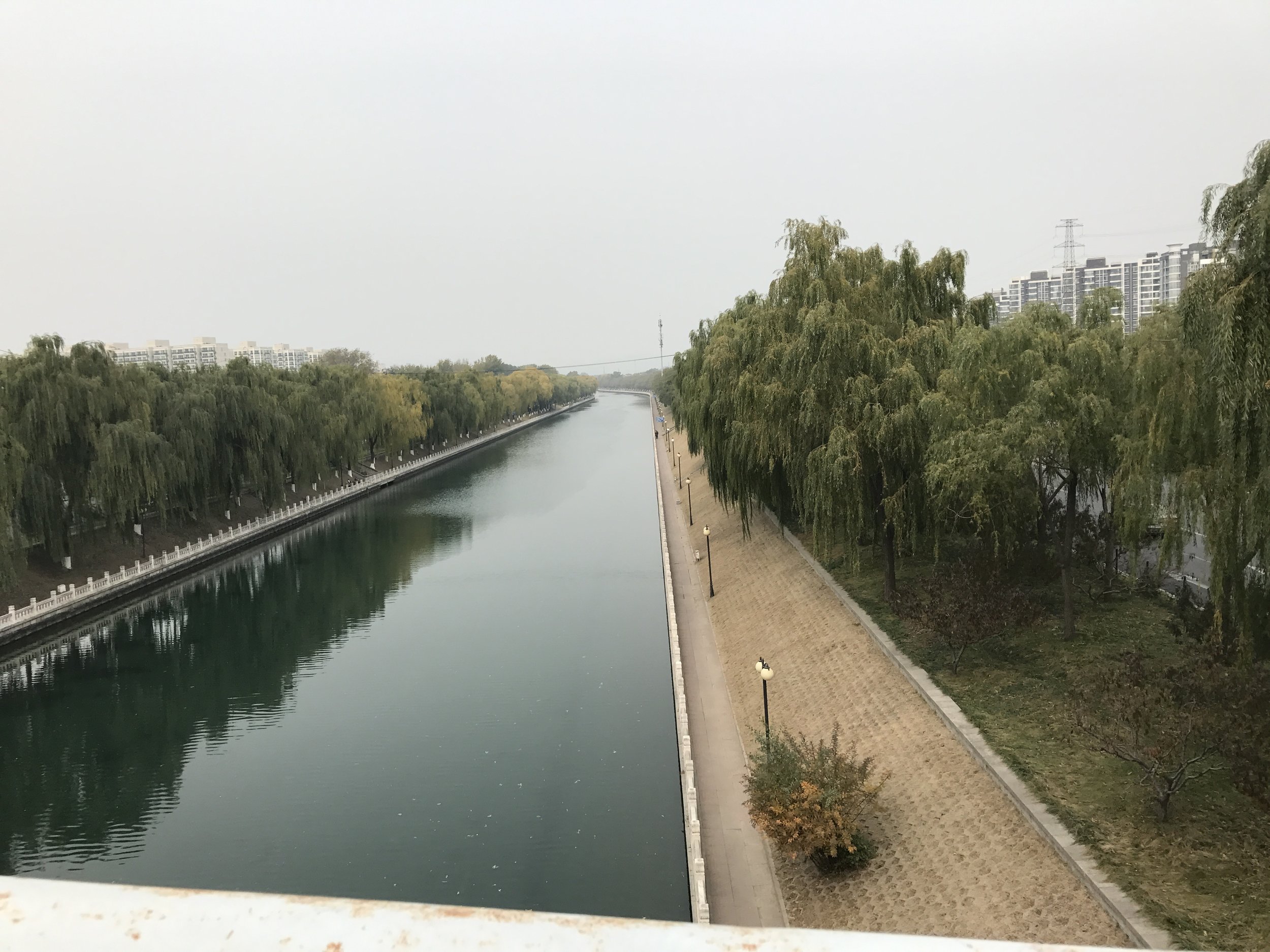 Canal under a bridge on the way to Youyi Shopping City