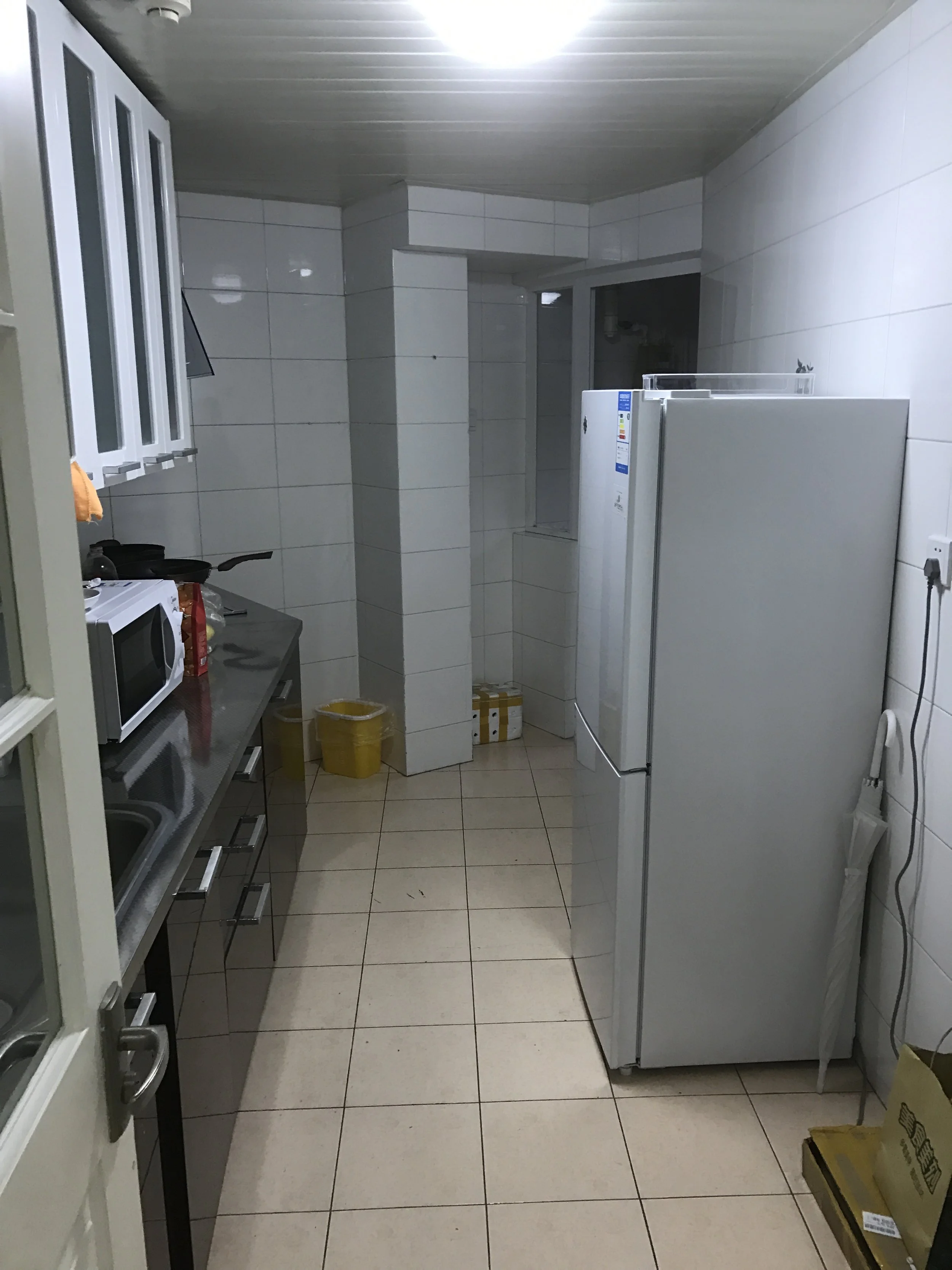 Kitchen, which has a door and leads to the laundry room.