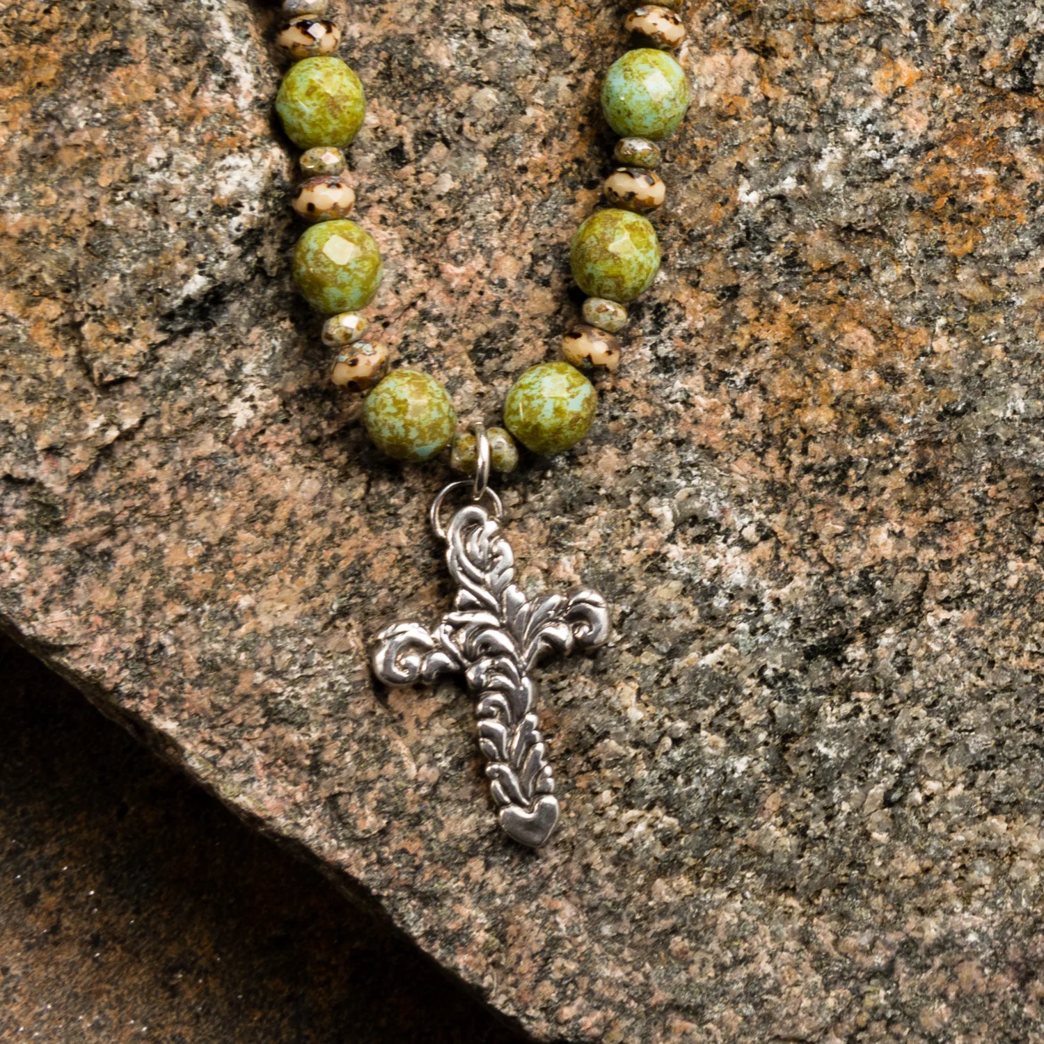 Sterling Silver sculpted cross on Czech glass bead necklace.