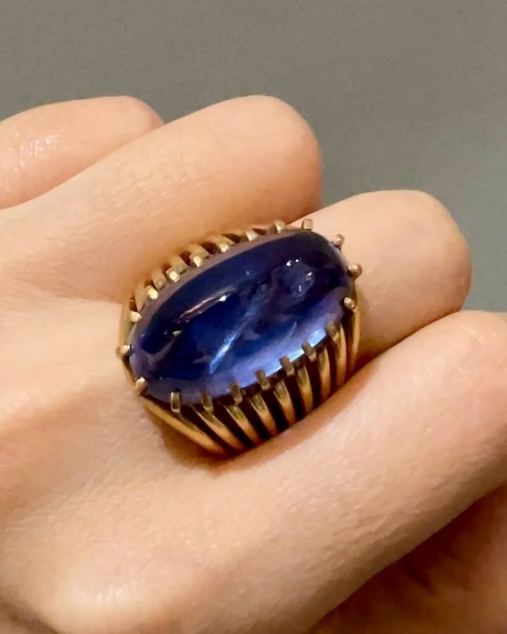 A cabochon sapphire single stone ring, designed by Suzanne Belperron (photo 3) for Boivin, Paris, circa 1935, the elongated oval shaped sapphire in an open wire 18kt gold mount. As featured on the map of Women Artists @tefaf curated by @merce_valderr