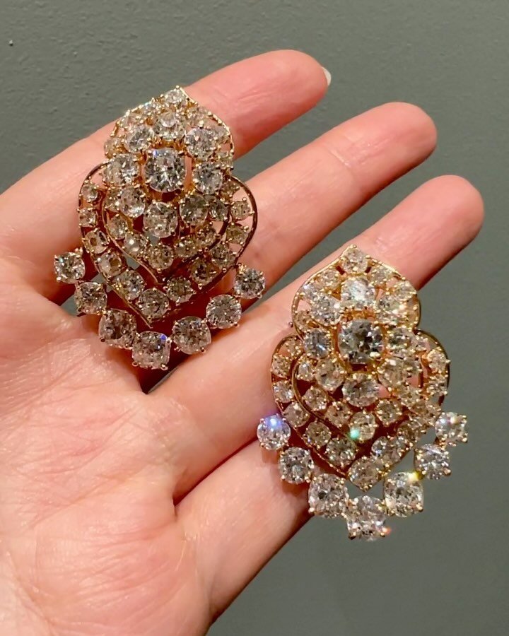 A pair of diamond earrings by Van Cleef &amp; Arpels, New York, c. 1980, each with an open oval cluster top suspending an articulated triple scroll band drop, mounted in 18kt gold. Available @simonteaklejewelry #vancleefvintage #vancleefearrings #vca