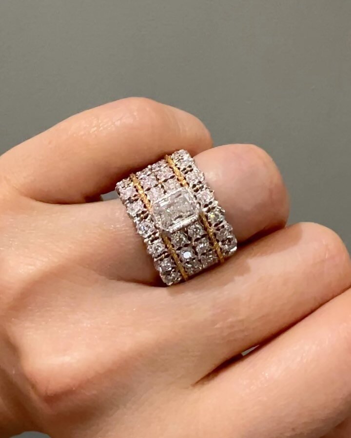 A diamond band ring by Buccellati, centering on a rectangular modified cut diamond within an open pierced four row band with scroll engraving mounted in yellow and white gold. Size 4 3/4 and Available @simonteaklejewelry #buccellatimilan #buccellati 