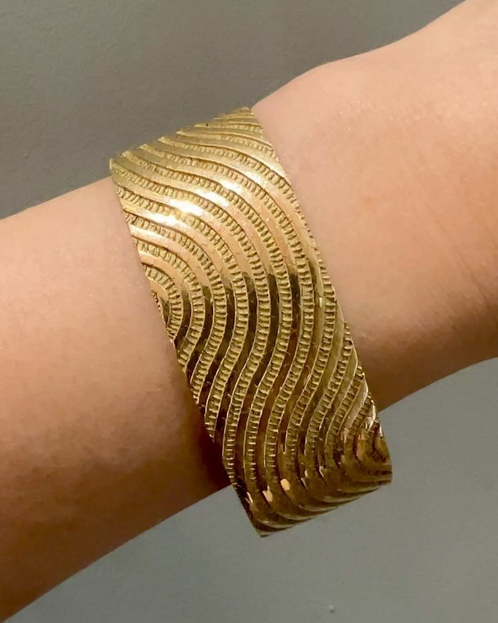 An 18kt gold &ldquo;Sinusoide&rdquo; optical bracelet by Georges Lenfant, Paris, c. 1965, the flat woven band with continuous scroll detail. Available @simonteaklejewelry #georgeslenfant #georgeslenfantbracelet #georgeslenfantoptical #simonteaklejewe