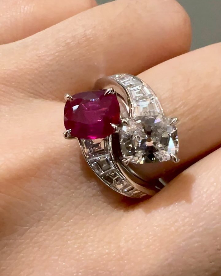 A cushion shaped ruby and diamond &ldquo;toi et moi&rdquo; cross over ring, with baguette cut diamond shoulders, mounted in platinum. Available @simonteaklejewelry #toietmoiring #burmanoheat #burmeseruby #rubydiamondring #simonteaklejewelry #simontea