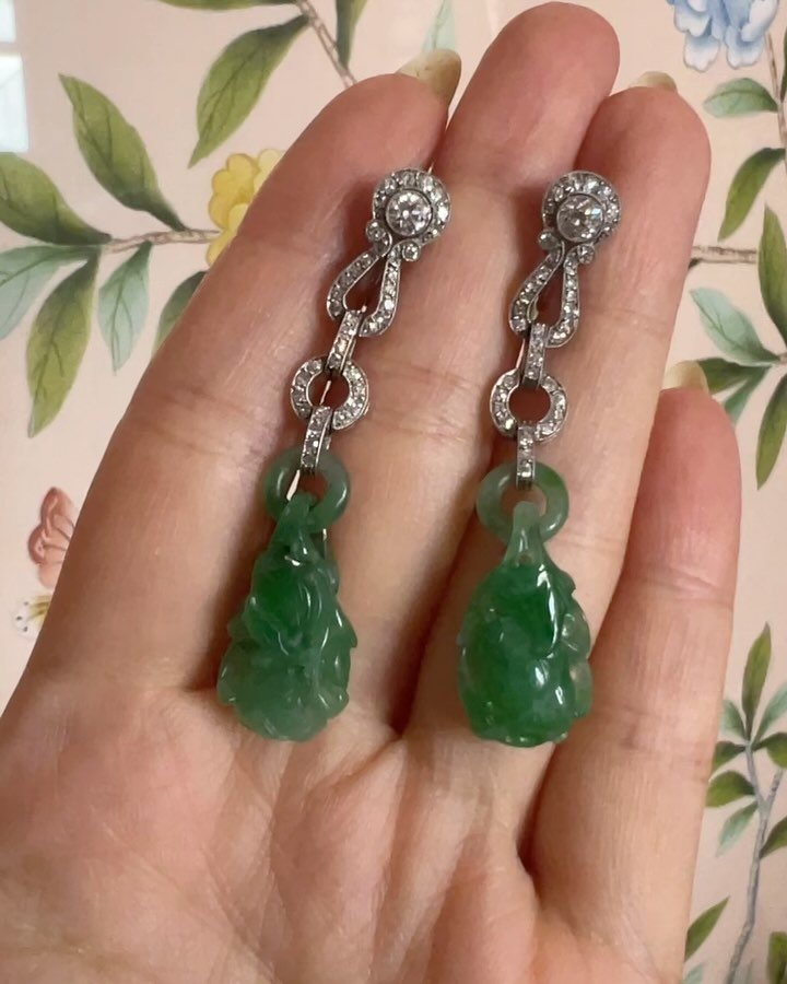 A pair of Art Deco jade and diamond earrings by Cartier, circa 1925, the vegetal carved jade drops suspended from an open diamond link platinum mount (restoration to jade) 

Available @simonteaklejewelry #artdecocartier #cartierearrings #artdecoearri