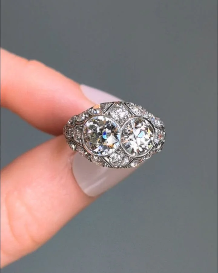 An Art Deco diamond cocktail ring, designed with two old european cut diamonds within a pave set diamond bombe platinum mount. Circa 1920. Available @simonteaklejewelry #artdecojewelry #artdecojewellery #artdecodiamondring #artdecodiamonds #oldeurodi