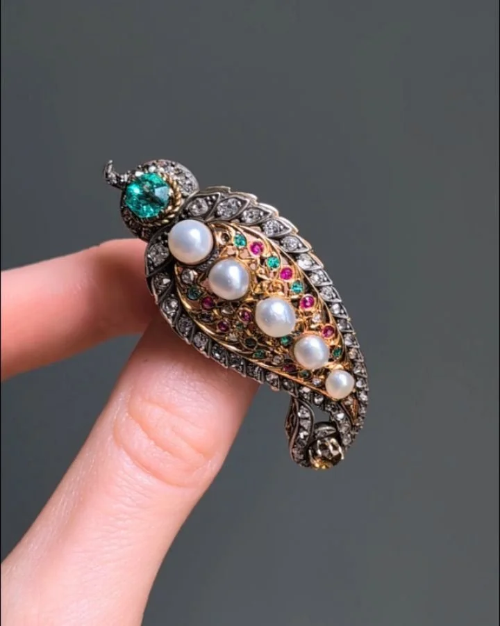 An antique pearl diamond and gem set brooch, of paisley design set with emerald and ruby detail mounted in silver and gold. French circa 1880. Available @simonteaklejewelry #diamondbrooch #antiquediamondbrooch #antiquebrooch #antiquejewellery #antiqu