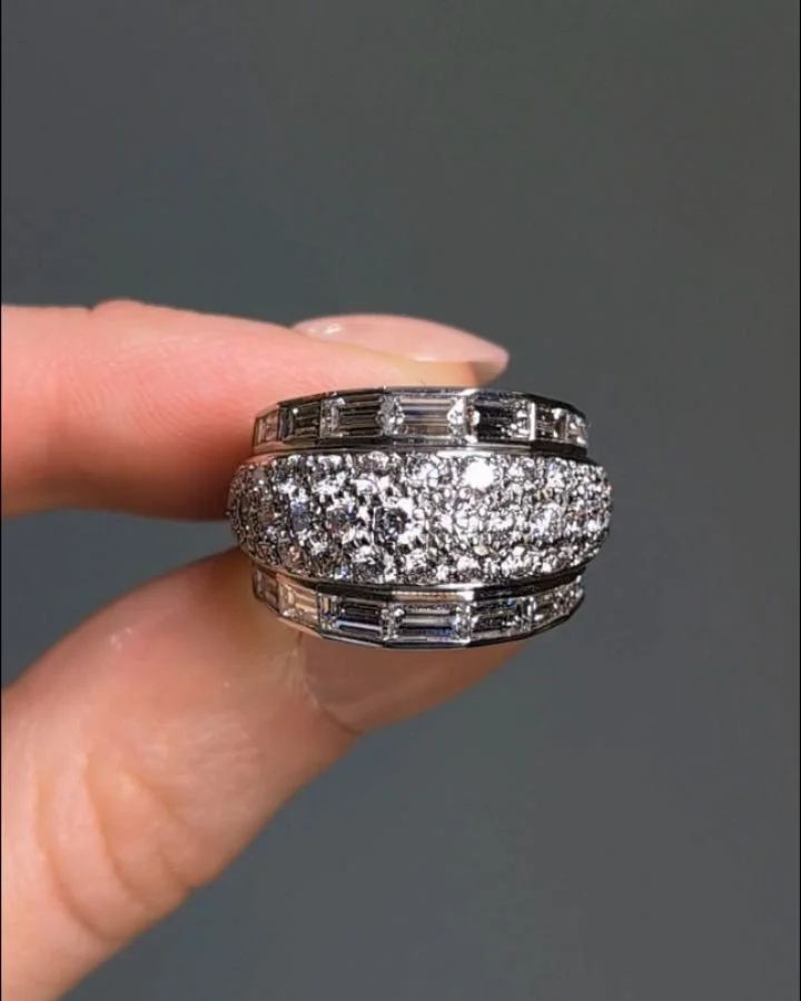 A diamond cocktail ring, of pave set bombe design with baguette cut diamond borders, mounted in 18kt white gold. Paris circa 1990. Available @simonteaklejewelry #vancleefarpels #vancleefjewelry #vancleefvintage #vcavintage #vcadiamonds #diamondbomber