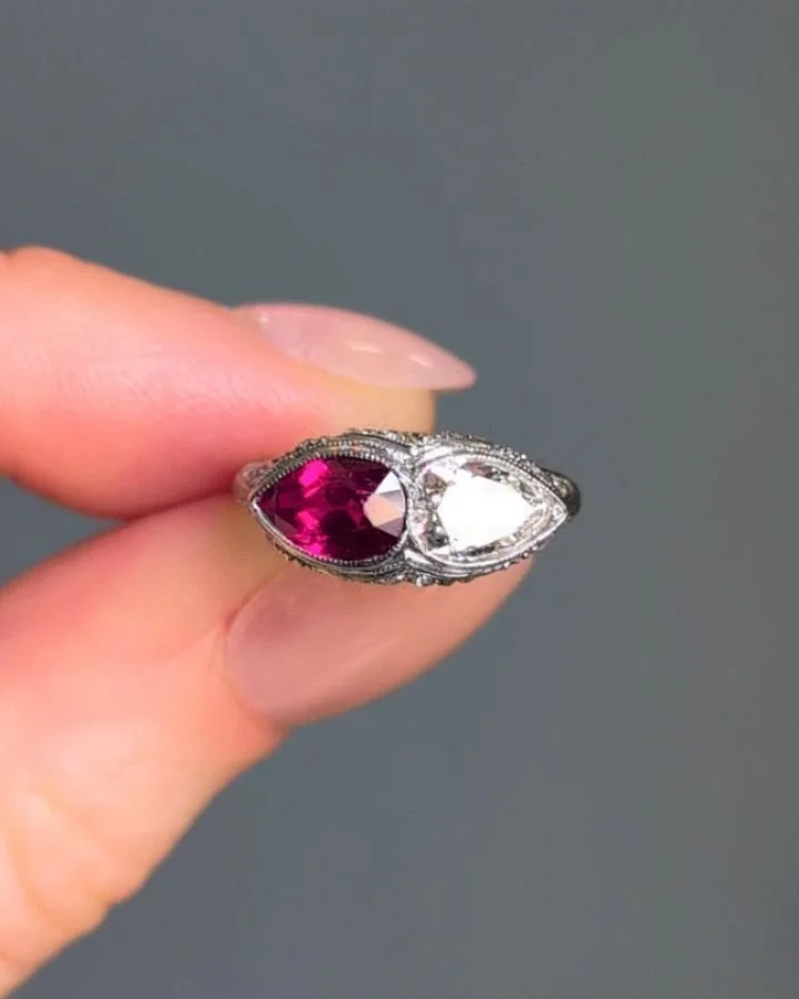 A Belle Epoque ruby and diamond twin ring, set with a pear shaped ruby and diamond with smaller circular cut diamond detail, mounted in platinum. Circa 1910. Available @simomteaklejewelry #belleepoquering #belleepoquebeauty #toietmoi #rubydiamomdring