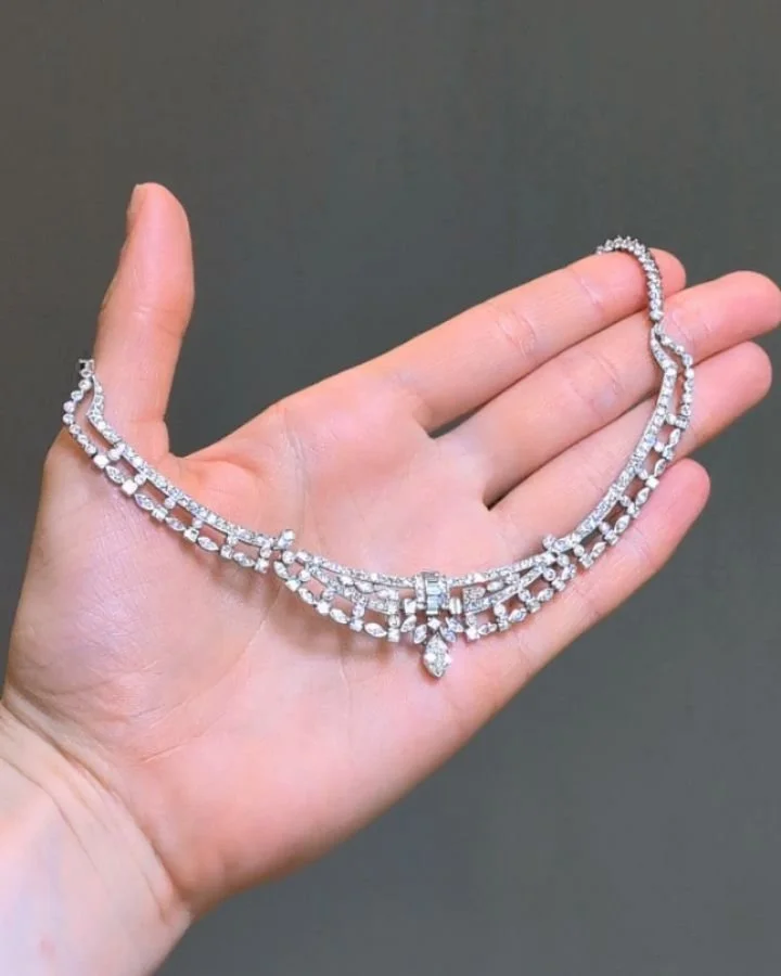 A diamond bib necklace by Raymond Yard, designed as an open festoon of circular, marquise and baguette cut diamonds, mounted in platinum. Available @simonteaklejewelry #raymondyard #raymondyardjewelry #raymondyardnecklace #raymondyarddiamondnecklace 