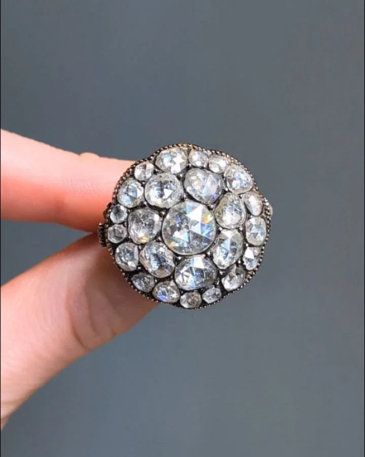 An antique rose cut diamond two tiered cluster ring, mounted in gold. Circa 1850 Available @simomteaklejewelry #antiquediamond #diamondclusterring #antiquediamondclusterring #rosecutdiamond #rosecutdiamondring #antiquerosecut #simonteaklejewelry #sim