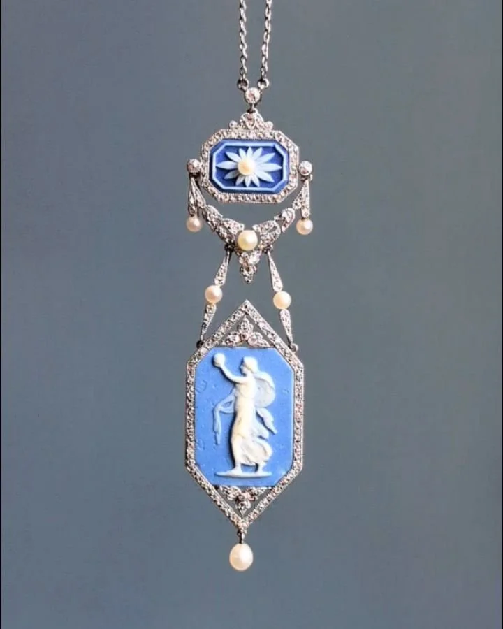 A diamond pendant, designed with two jasperware Wedgwood panels within a platinum diamond and natural pearl garland frame on a fine link chain. 2 1/2 inches long. Available @simonteaklejewelry #wedgwood #wedgwoodjewelry #wedgwoodpendant #jasperware #
