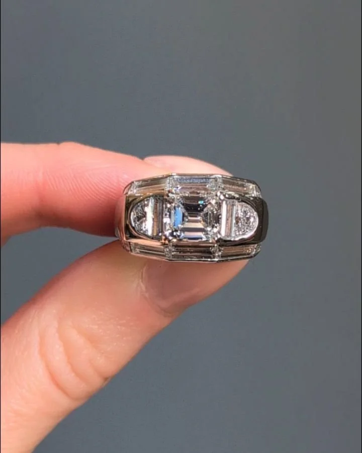 A diamond cocktail ring by Van Cleef &amp; Arpels, the central rectangular cut diamond with half moon cut diamond shoulders and baguette cut diamond detail to the platinum mount. Circa 1960. Available @simomteaklejewelry #vancleefarpels #vancleefjewe