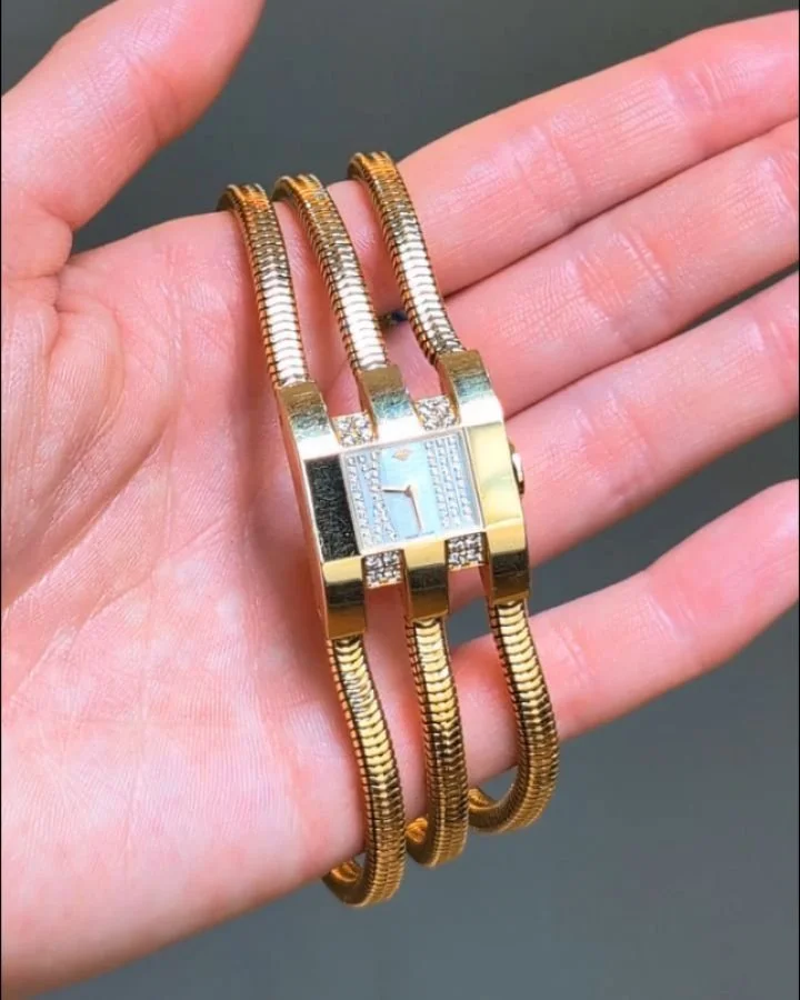 An 18kt gold and diamond watch by Van Cleef &amp; Arpels, the rectangular stylized diamond set dial on a three row Brazilian link band. Circa 2000. Available @simonteaklejewelry #vca #vcawatch #vancleefarpels #vancleefarpelsjewelry #brazillianlinkjew
