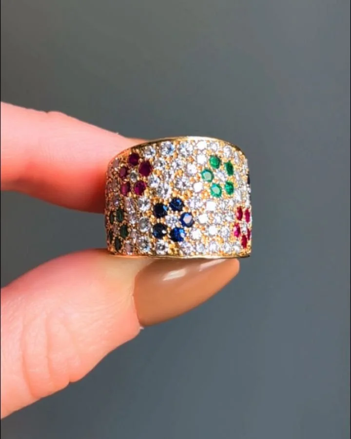A pave set diamond and gem set band ring by Van Cleef &amp; Arpels, designed with ruby emerald and sapphire floral motifs, mounted in 18kt gold. Circa 1980. Available @simomteaklejewelry #vancleefarpels #vancleefjewelry #vancleefvintage #vcavintage #