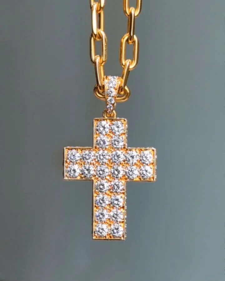 A pave set diamond cross by Cartier, mounted in 18kt gold suspended from an open rectangular link chain. Paris circa 1980. Available @simonteaklejewelry #cartier #cartiernecklace #cartiercross #cartierdiamondcross #cartierpendant vintagecartier vinta