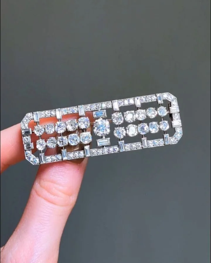 An Art Deco diamond brooch, of open rectangular panel design, set with circular and baguette cut diamonds, mounted in platinum. French circa 1925. Available @simonteaklejewelry #artdecobrooch #artdecodiamonds #artdecodiamondbrooch #antiquejewelry #an