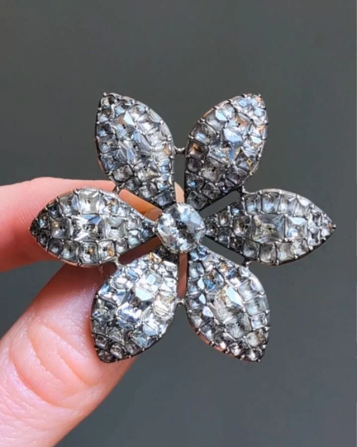 An antique paste brooch, designed as a hexafoil pave set floral motif mounted in silver. English circa 1780. Available @simonteaklejewelry #antiquebrooch #antiquepastebrooch #antiquepaste #georgianjewelry #georgianjewellery #georgianpaste #flowerbroo