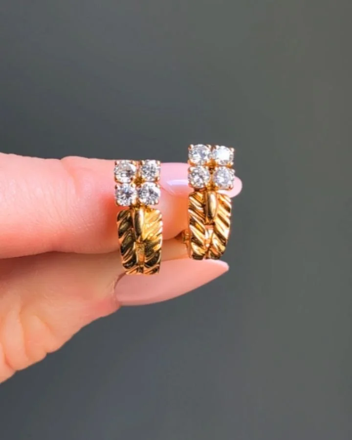 A pair of 18kt gold and diamond earrings by Boucheron, each designed as a two row gold hoop with a circular cut diamond quatrefoil top. Paris circa 1965. Available @simonteaklejewelry #vintageboucheron #vintageboucheronearrings #boucheronearrings #bo