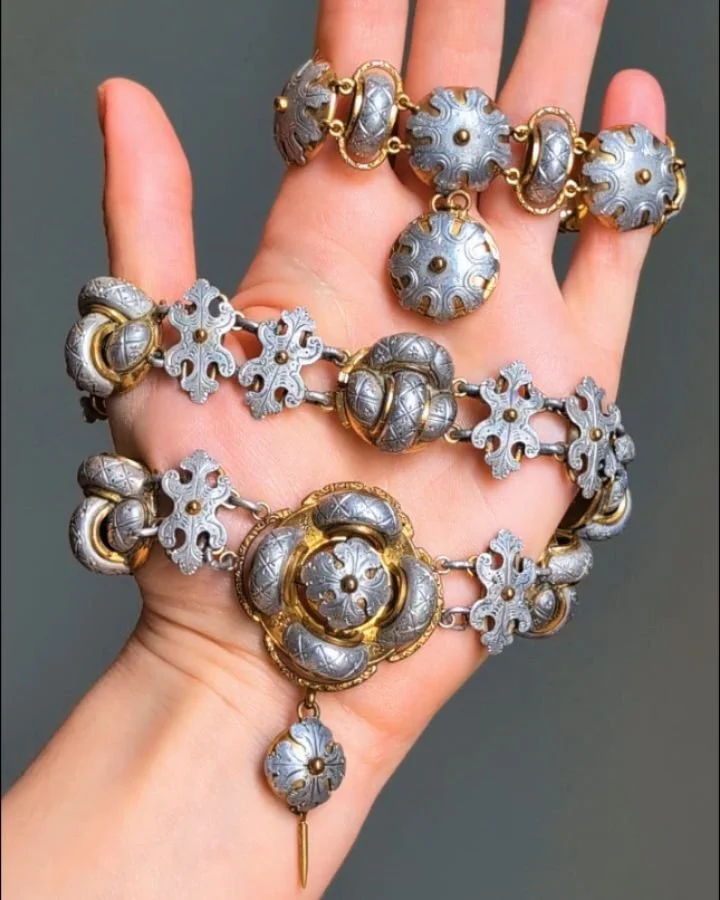 An antique aluminum and gilt metal necklace and bracelet, designed as a series of textured quatrefoil motifs, with a single pendant drop. English, circa 1870. Available @simonteaklejewelry #antiquealuminum #antiquealuminumjewelry #victorianjewelry #v