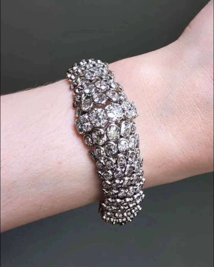 A diamond bracelet by Ren&eacute; Boivin, designed as a tapering bombe band with scalloped motifs and baguette diamond clasp, mounted in platinum. Paris circa 1937. Ren&eacute; Boivin Jeweller, Fran&ccedil;oise Cailles, Quartet Books, Page 197. Avail