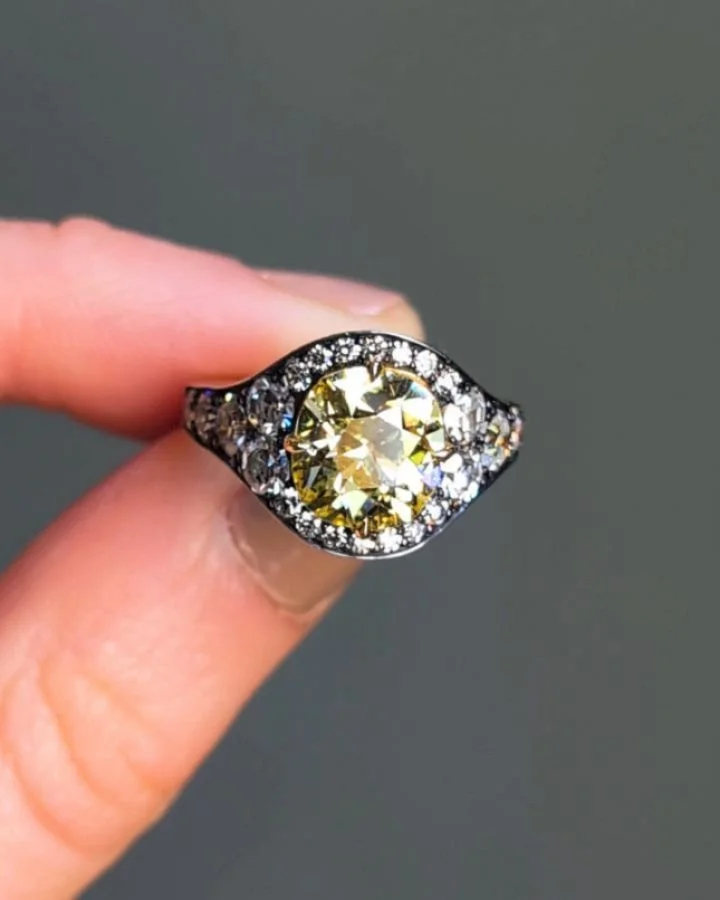 A Fancy Yellow diamond ring, the central cushion shaped 2.62 carats diamond with single cut diamond surround and mounted in silver and gold. Available @simonteaklejewelry #yellowdiamond #uniqueengagementring #fancyyellow #fancyyellowdiamond #engageme