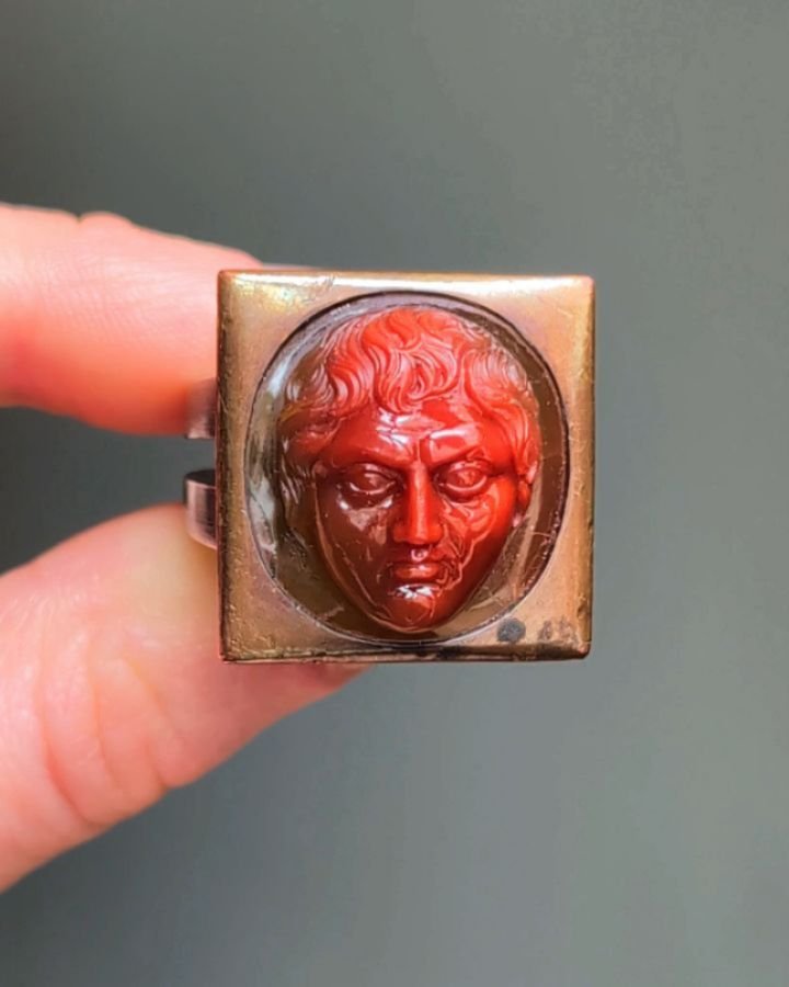 A cameo ring, depicting a classical male head by Hemmerle, within a plain bezel square frame, mounted in copper, silver and 18kt white gold. Available @simonteaklejewelry #hemmerle #hemmerlejewelry #hemmerlemunich #hemmerlering #hemmerlecameoring #ca